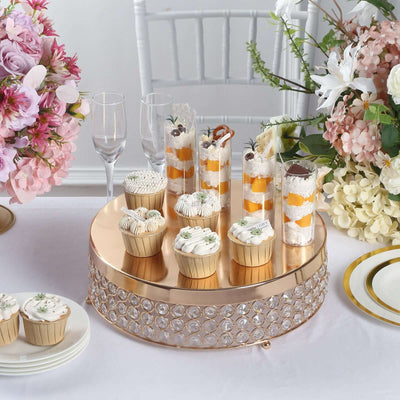 Elegant dessert display with cupcakes and parfaits on a golden cake stand.