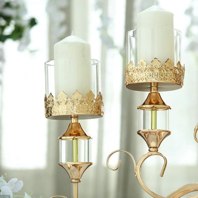 Elegant gold and glass candle holders with white candles