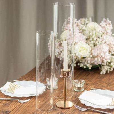 Elegant glass candle holders with gold bases, perfect for table decor.