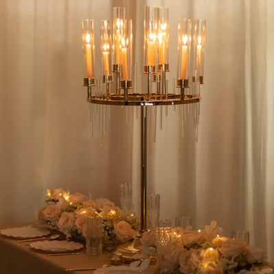 Elegant candle holder centerpiece with soft glowing lights and floral decor.