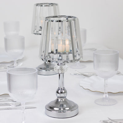 Crystal table lamp with candle on a dining table setting.