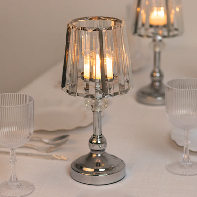 Elegant crystal lamp with warm candlelight, perfect for dining ambiance.