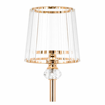 Gold and crystal table lamp with clear pleated shade on white background