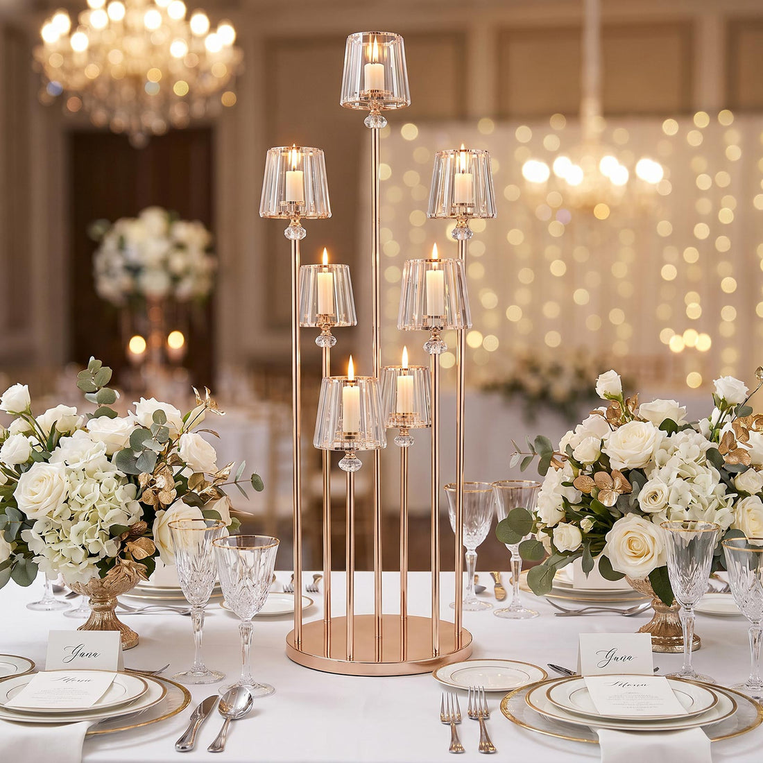 Elegant wedding table centerpiece with crystal candle holders and white floral arrangements