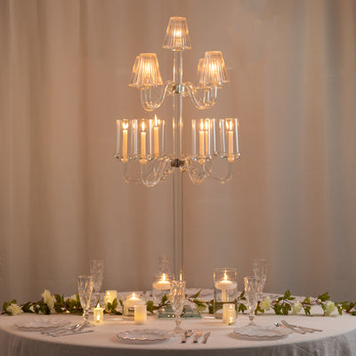 Elegant crystal chandelier centerpiece on a beautifully set dining table.
