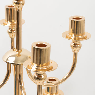 Gold candle holder with multiple arms and cup-shaped bases