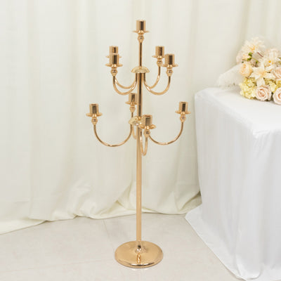 Elegant gold candelabra with multiple arms for candle display.