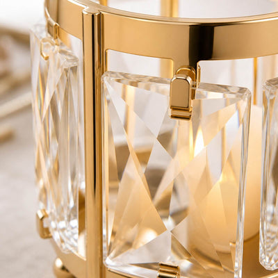 Gold crystal chandelier close-up with faceted glass and luxury metal frame