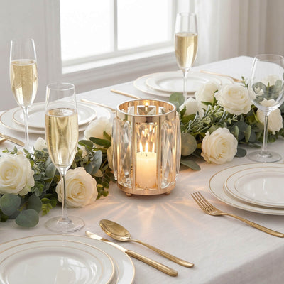 Elegant white and gold wedding table setting with roses and champagne flutes