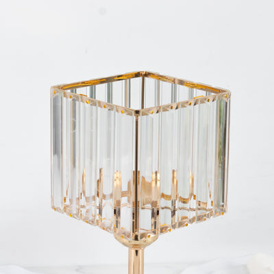 Gold and crystal square lamp with vertical lines and a modern design