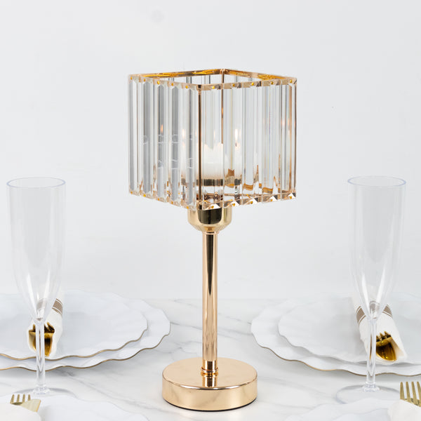 Elegant glass table lamp with gold base, surrounded by dinnerware.