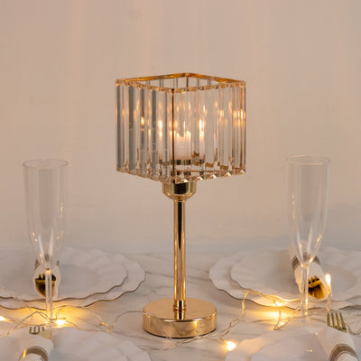 Elegant gold and crystal table lamp on a dining table with twinkling lights.