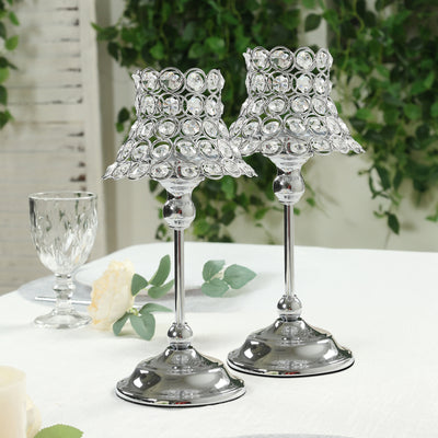 Elegant crystal candle holders on a table setting.