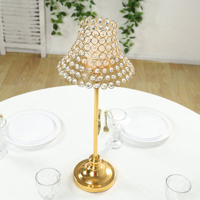 Elegant gold table lamp with crystal accents on a dining table.