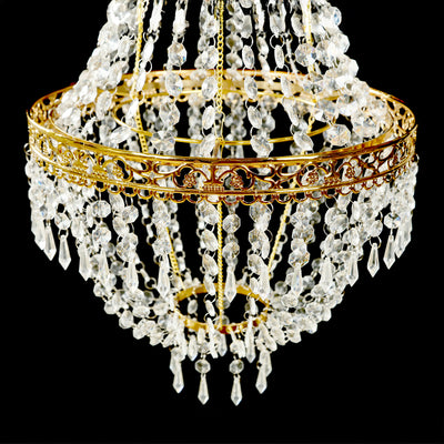 Elegant crystal chandelier with intricate gold detailing.