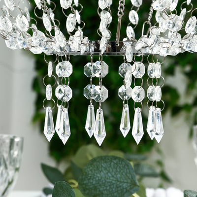 Elegant crystal chandelier with intricate detailing and sparkling pendants.