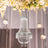 Elegant crystal chandelier hanging with floral decor.
