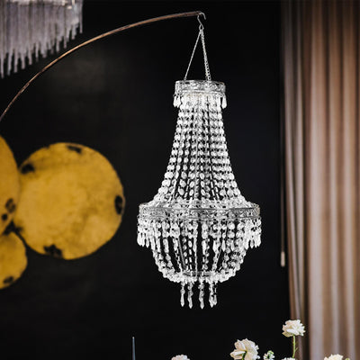 Elegant crystal chandelier hanging in a modern interior setting.
