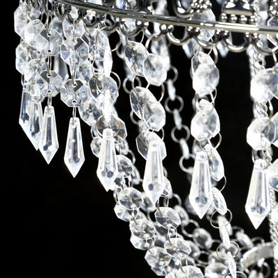 Crystal chandelier with intricate detailing and shimmering beads.