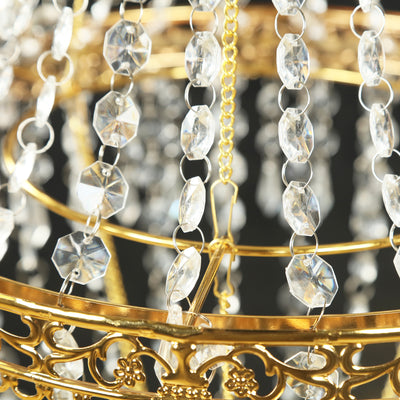 Gold chandelier with crystal beads and intricate detailing.