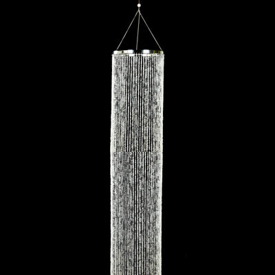 Silver beaded curtain hanging from a ceiling hook.