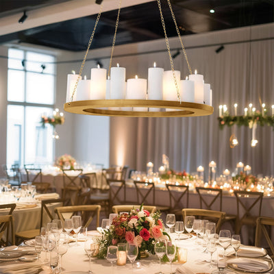 Elegant chandelier with white candles in a beautifully set dining area.