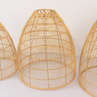 Woven bamboo lampshade in a conical shape against a white background
