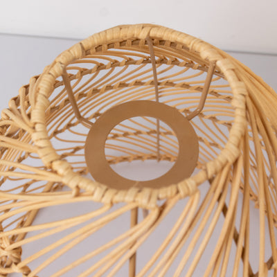 Rattan lamp shade interior view with intricate woven design.