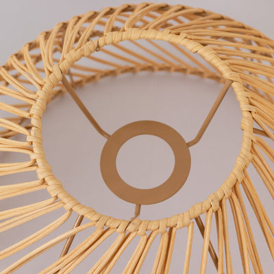 Rattan lamp shade with a circular design and metal base