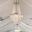 Elegant crystal chandelier hanging under a white tent ceiling