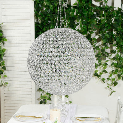 Crystal globe chandelier hanging elegantly in a decorated dining space.