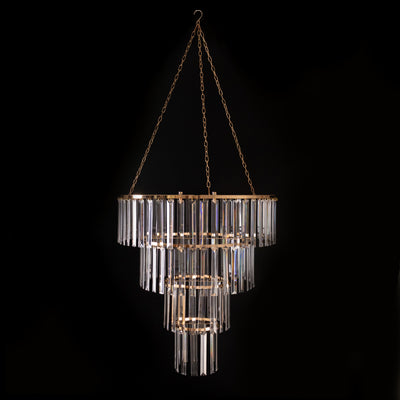 Elegant crystal chandelier with gold accents, suspended against a black background.