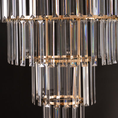 Elegant crystal chandelier with gold accents and prism details.