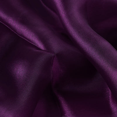 Purple satin fabric texture close-up.