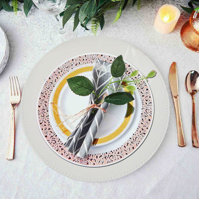 Elegant table setting with decorative plates and a napkin arrangement.