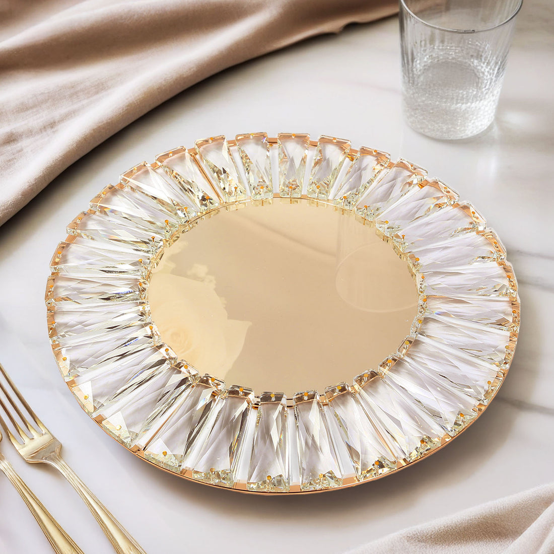 Elegant gold and crystal decorative plate with a mirrored center.