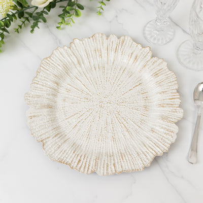 Textured white decorative plate with a scalloped edge.