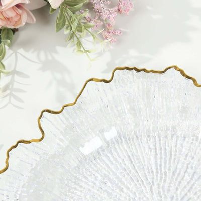 Clear glass decorative bowl with a wavy gold rim.
