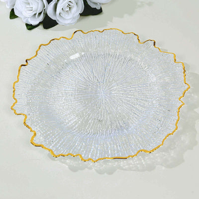 Clear glass plate with a textured design and gold rim.
