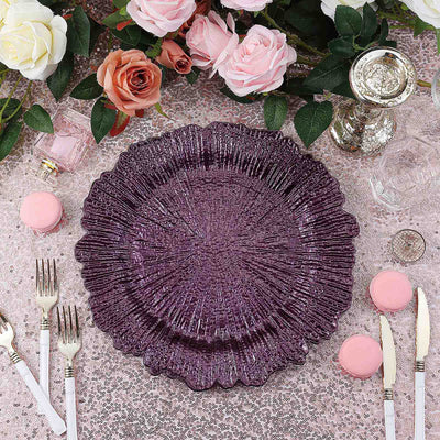Purple decorative plate on an elegant table setting with flowers and macarons.