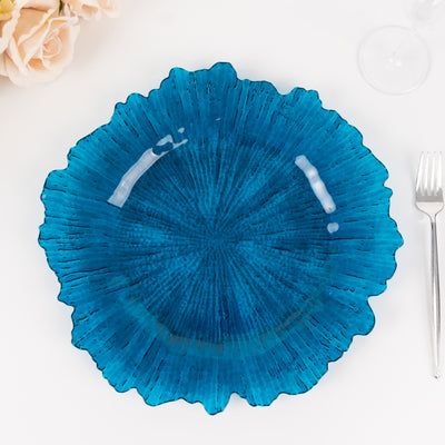 Blue decorative plate with a textured, fluted edge design.