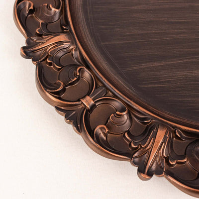 Ornate bronze decorative plate with intricate detailing.