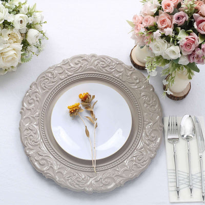 Elegant decorative plate with floral accent, set on a table with flowers.