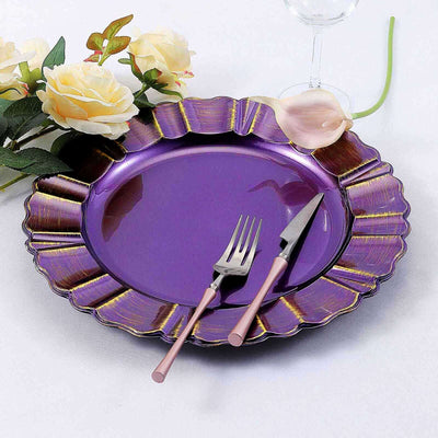 Purple scalloped plate with pink utensils and flowers.