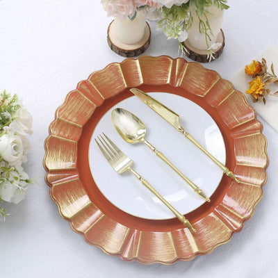 Elegant gold-accented dinnerware set with plate, fork, knife, and spoon.