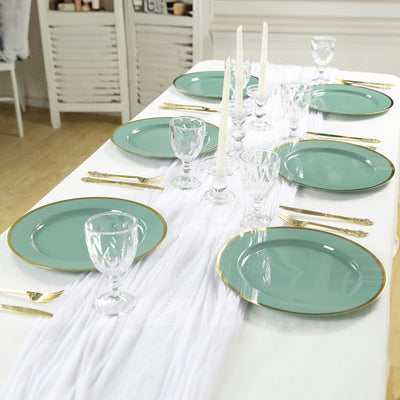 Elegant teal dinnerware set on a beautifully arranged dining table.