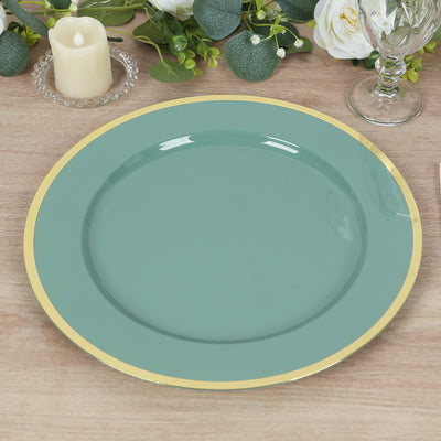 Teal dinner plate with gold rim on wooden table