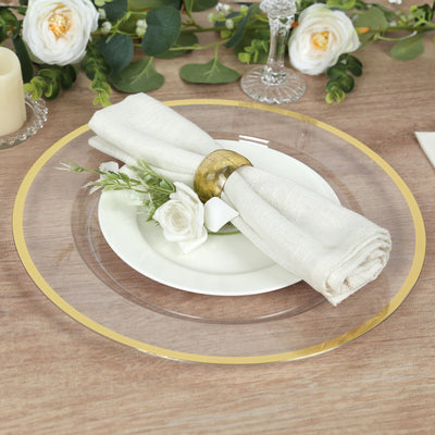 Elegant table setting with gold-accented charger plate and floral napkin decor.