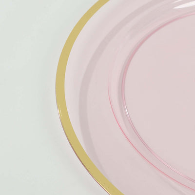 Pink plate with a gold rim on a white background