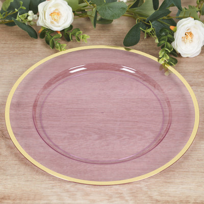 Purple glass plate with gold rim against a wooden background.
